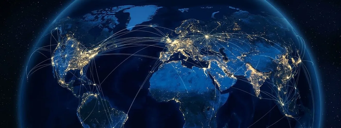 La Terre la nuit avec des villes illuminées et des connexions mondiales